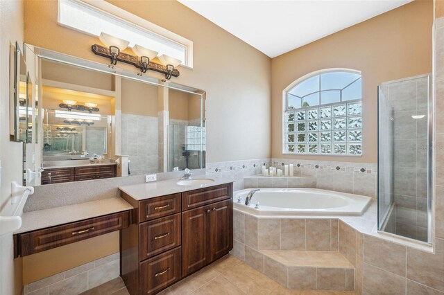 4080 Gevalia Dr, Brooksville, FL 34604 - full bath featuring a garden tub, tile patterned flooring, a stall shower, and vanity