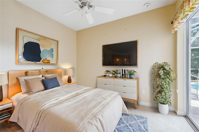 4080 Gevalia Dr, Brooksville, FL 34604 - carpeted bedroom featuring access to outside, a ceiling fan, and baseboards
