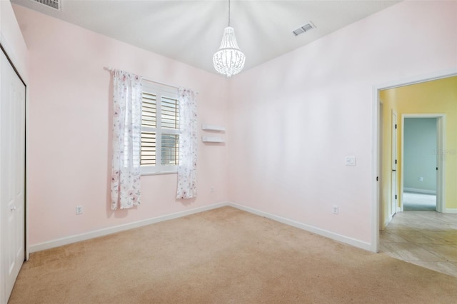 4080 Gevalia Dr, Brooksville, FL 34604 - carpeted spare room with a chandelier, baseboards, and visible vents