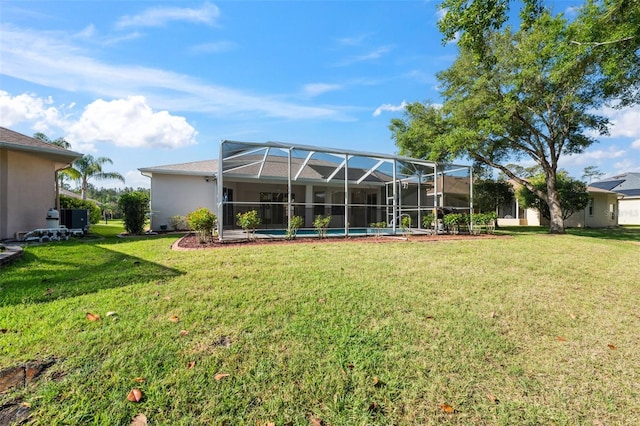 4080 Gevalia Dr, Brooksville, FL 34604 - rear view of property featuring a lawn, glass enclosure, and stucco siding