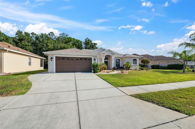 4080 Gevalia Dr, Brooksville, FL 34604 - view of front facade with an attached garage, stucco siding, driveway, and a front yard