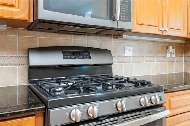 4080 Gevalia Dr, Brooksville, FL 34604 - details with appliances with stainless steel finishes, tasteful backsplash, and dark stone countertops