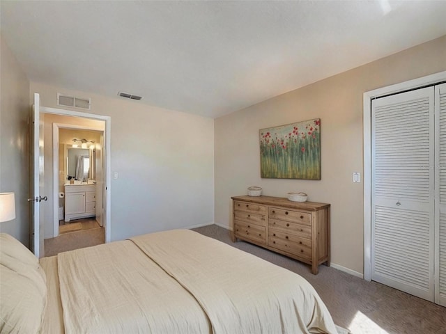 bedroom featuring light colored carpet, baseboards, visible vents, and a closet
