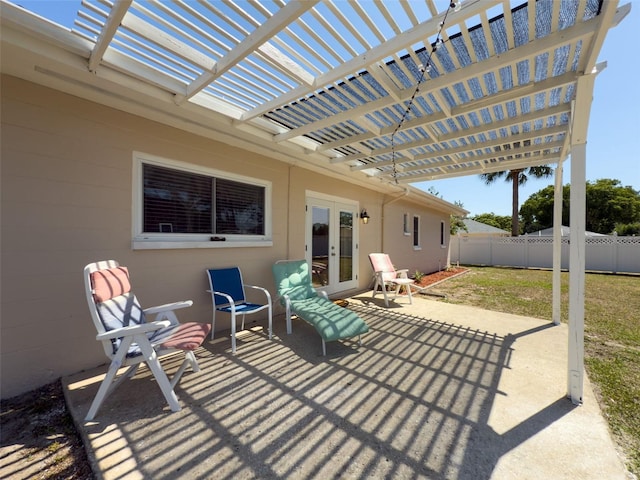 view of patio / terrace with a pergola, fence, and french doors