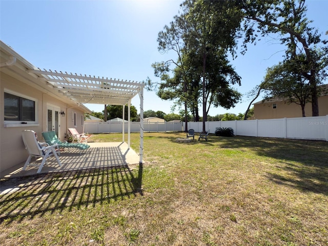 view of yard with a fenced backyard, a patio area, and a pergola