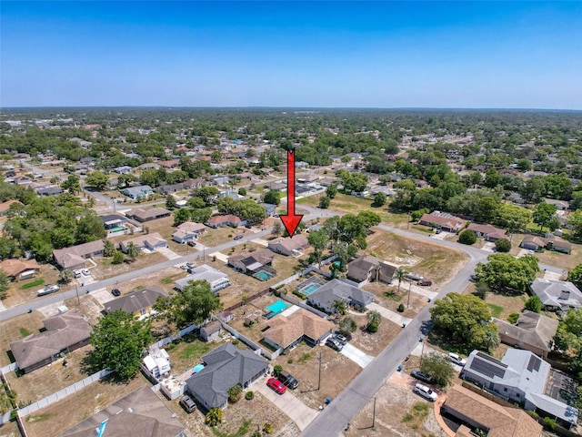 birds eye view of property with a residential view