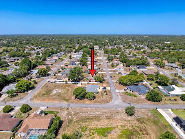birds eye view of property with a residential view