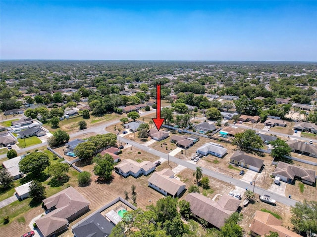 birds eye view of property with a residential view