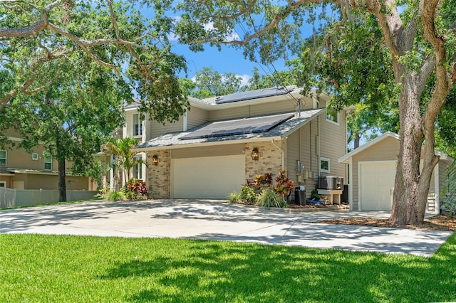 520 Lafayette Blvd, Oldsmar, FL 34677 - traditional-style home featuring driveway, brick siding, and solar panels