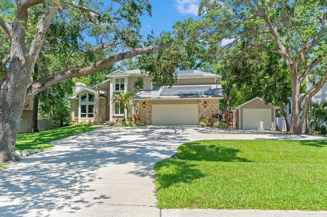 520 Lafayette Blvd, Oldsmar, FL 34677 - view of front facade with a front lawn, brick siding, and driveway