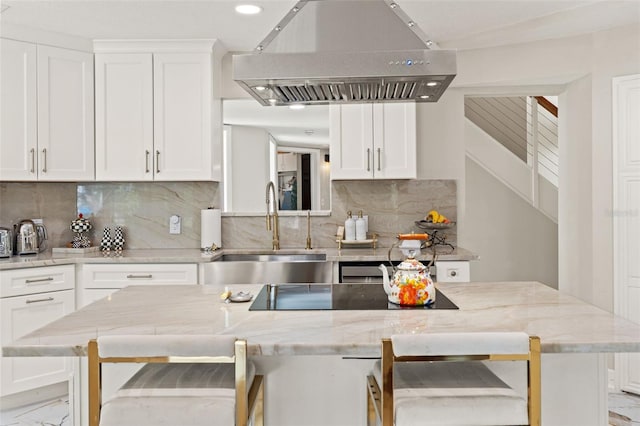 520 Lafayette Blvd, Oldsmar, FL 34677 - kitchen featuring marble finish floor, ventilation hood, a sink, and white cabinets