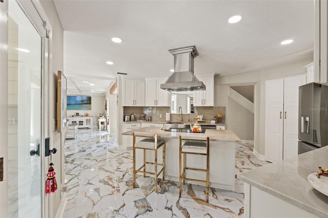 520 Lafayette Blvd, Oldsmar, FL 34677 - kitchen featuring exhaust hood, stainless steel refrigerator with ice dispenser, recessed lighting, white cabinetry, and decorative backsplash