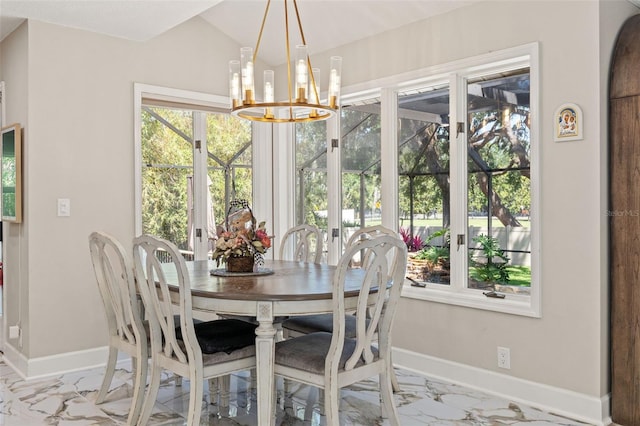 520 Lafayette Blvd, Oldsmar, FL 34677 - dining space featuring baseboards, marble finish floor, lofted ceiling, and a chandelier