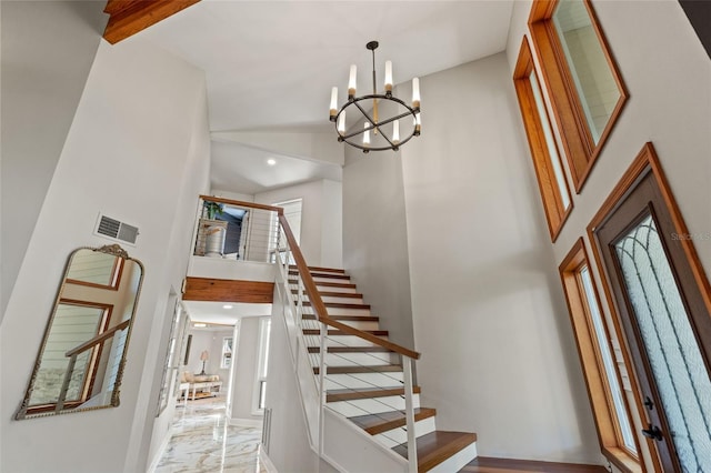 520 Lafayette Blvd, Oldsmar, FL 34677 - stairs featuring recessed lighting, marble finish floor, an inviting chandelier, visible vents, and a high ceiling