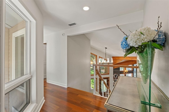 520 Lafayette Blvd, Oldsmar, FL 34677 - hallway with wood finished floors, an upstairs landing, recessed lighting, visible vents, and an inviting chandelier