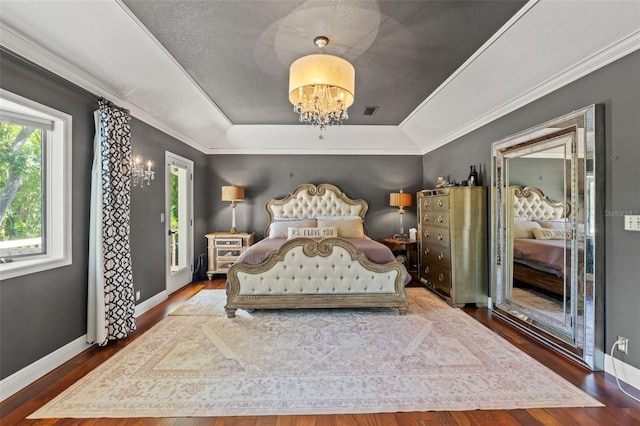 520 Lafayette Blvd, Oldsmar, FL 34677 - bedroom with a tray ceiling, an inviting chandelier, wood finished floors, and multiple windows