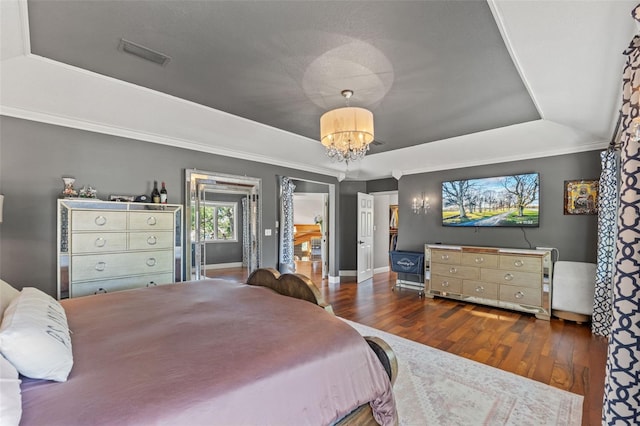 520 Lafayette Blvd, Oldsmar, FL 34677 - bedroom with a tray ceiling, visible vents, and wood finished floors