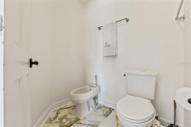 520 Lafayette Blvd, Oldsmar, FL 34677 - half bath featuring toilet, baseboards, marble finish floor, and a bidet