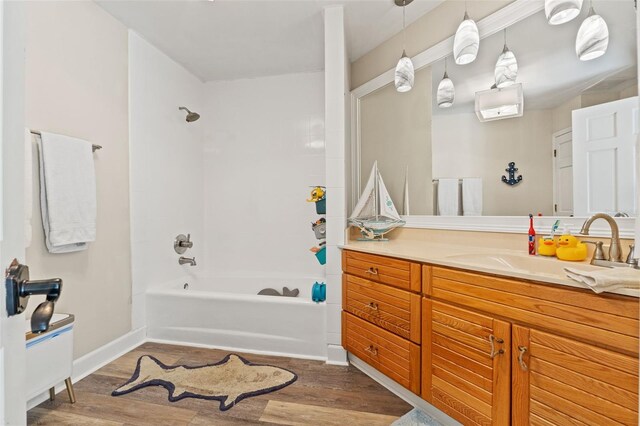520 Lafayette Blvd, Oldsmar, FL 34677 - full bathroom with baseboards, tub / shower combination, wood finished floors, and vanity