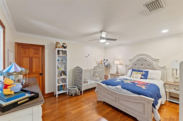 520 Lafayette Blvd, Oldsmar, FL 34677 - bedroom featuring visible vents, recessed lighting, crown molding, light wood-style flooring, and a ceiling fan