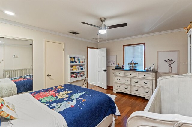 520 Lafayette Blvd, Oldsmar, FL 34677 - bedroom featuring crown molding, visible vents, and wood finished floors
