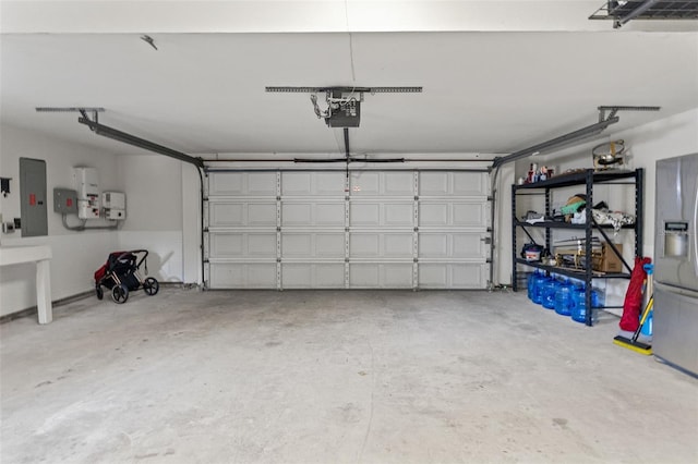 520 Lafayette Blvd, Oldsmar, FL 34677 - garage featuring electric panel and a garage door opener