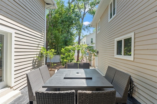 520 Lafayette Blvd, Oldsmar, FL 34677 - view of patio featuring outdoor dining space and fence