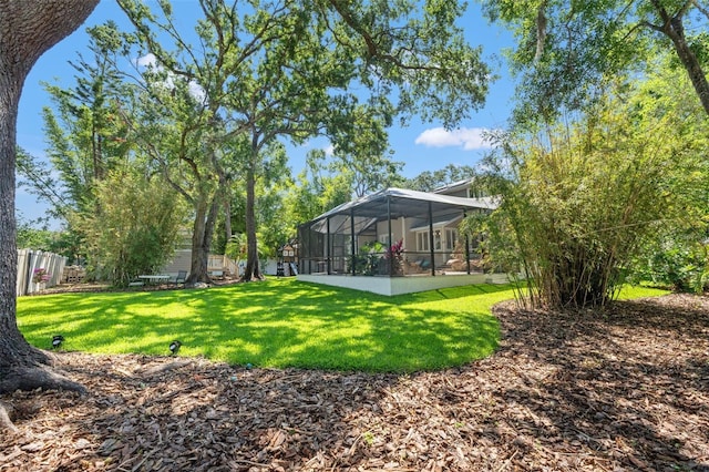 520 Lafayette Blvd, Oldsmar, FL 34677 - view of yard featuring fence and glass enclosure