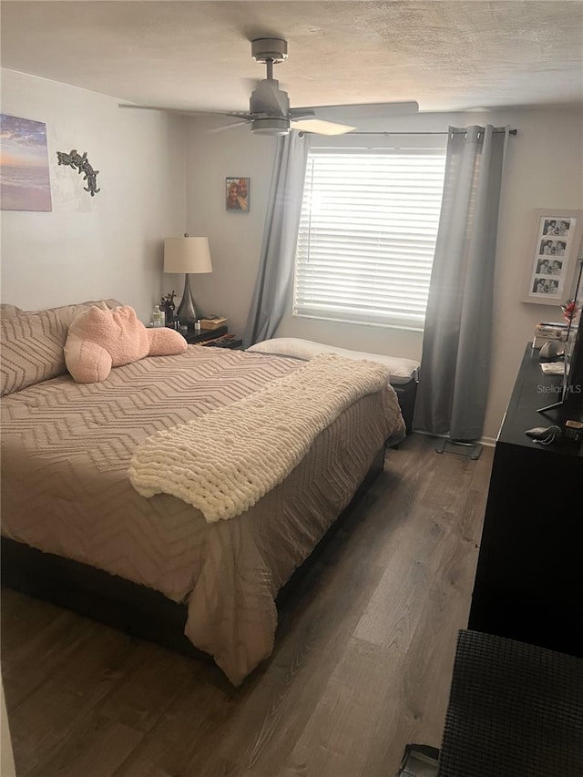 4264 Tamargo Dr Unit 3, New Port Richey, FL 34652 - bedroom featuring a ceiling fan and wood finished floors