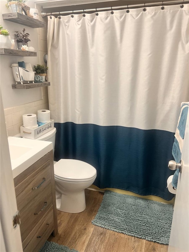 4264 Tamargo Dr Unit 3, New Port Richey, FL 34652 - bathroom featuring vanity, toilet, a shower with curtain, and wood finished floors