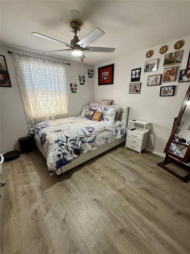4264 Tamargo Dr Unit 3, New Port Richey, FL 34652 - bedroom with wood finished floors and ceiling fan