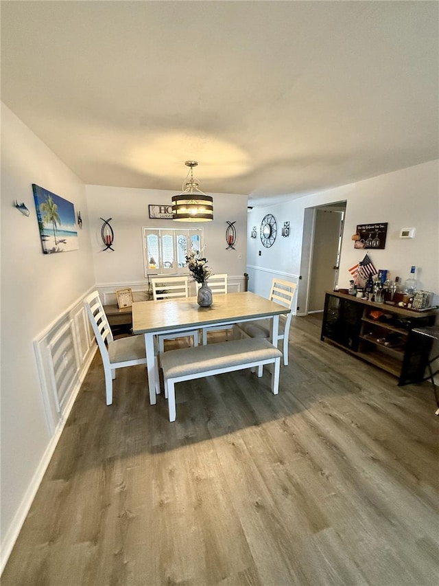 4264 Tamargo Dr Unit 3, New Port Richey, FL 34652 - dining area with an inviting chandelier and wood finished floors