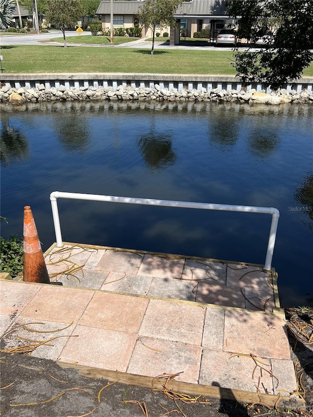 4264 Tamargo Dr Unit 3, New Port Richey, FL 34652 - exterior space featuring a water view and a lawn