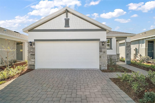4106 NW 44th Cir, Ocala, FL 34482 - view of front of house with decorative driveway, stucco siding, and stone siding