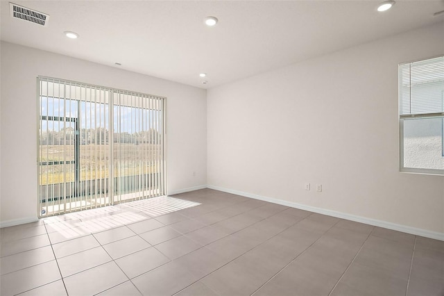 4106 NW 44th Cir, Ocala, FL 34482 - empty room featuring baseboards, tile patterned flooring, recessed lighting, and visible vents