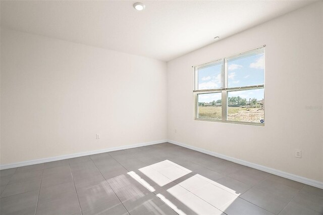 4106 NW 44th Cir, Ocala, FL 34482 - tiled spare room with baseboards