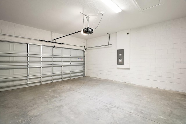4106 NW 44th Cir, Ocala, FL 34482 - garage featuring a garage door opener, electric panel, and concrete block wall