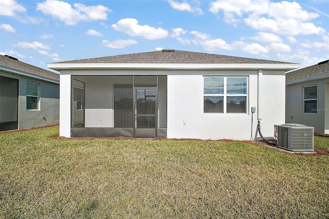 4106 NW 44th Cir, Ocala, FL 34482 - back of property featuring a lawn, central AC, a sunroom, and stucco siding