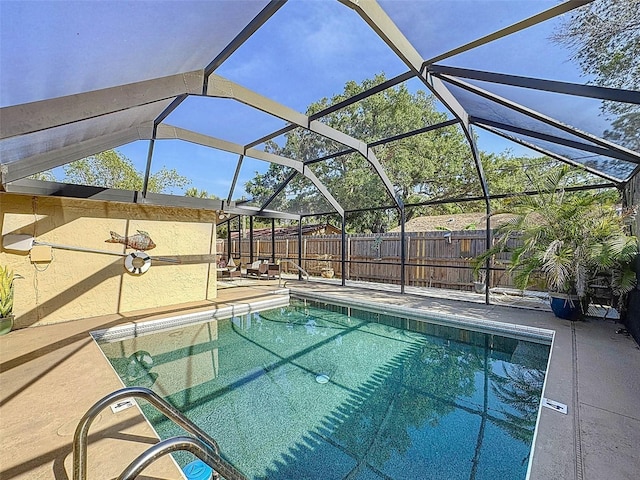 view of pool with a fenced in pool, a lanai, a fenced backyard, and a patio area