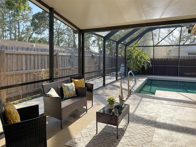 view of pool featuring a fenced backyard, a fenced in pool, a patio, and a lanai