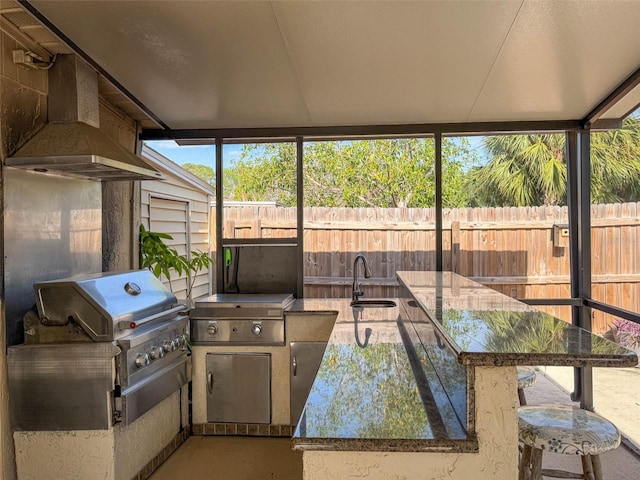 sunroom / solarium featuring a sink