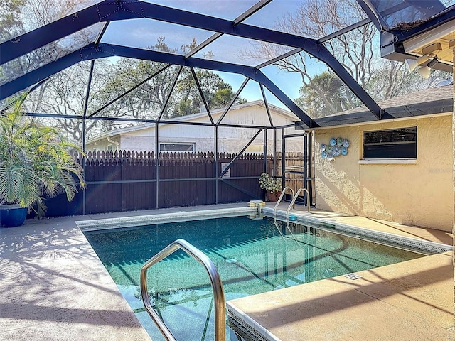 view of pool featuring a fenced in pool, a lanai, fence, and a patio