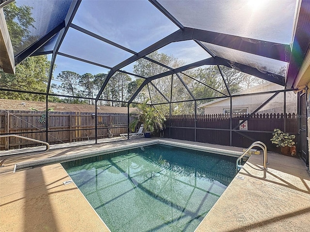 view of swimming pool with a fenced backyard, a fenced in pool, a lanai, and a patio