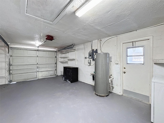 garage featuring a garage door opener, washer / dryer, and water heater