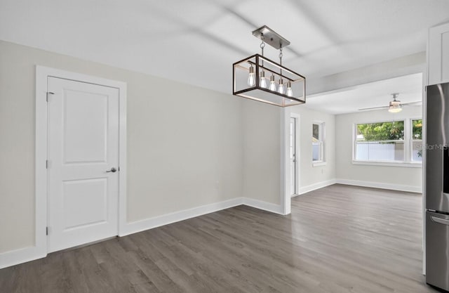 2175 Edythe Dr, Dunedin, FL 34698 - unfurnished dining area featuring a chandelier and dark wood-style floors
