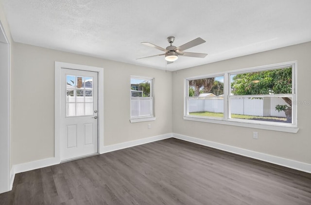 2175 Edythe Dr, Dunedin, FL 34698 - foyer entrance with dark wood-style floors and a ceiling fan