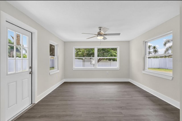 2175 Edythe Dr, Dunedin, FL 34698 - unfurnished room with a ceiling fan, plenty of natural light, and dark wood finished floors