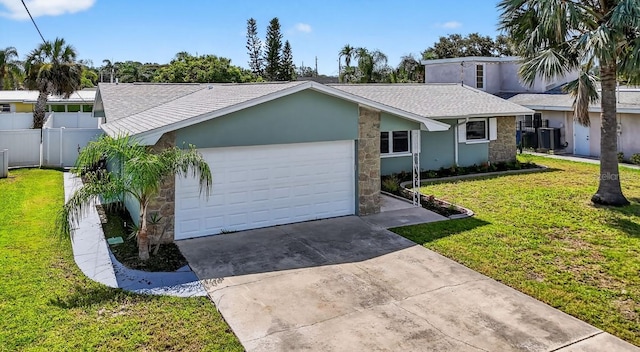 2175 Edythe Dr, Dunedin, FL 34698 - mid-century home featuring stone siding, driveway, a garage, roof with shingles, and stucco siding