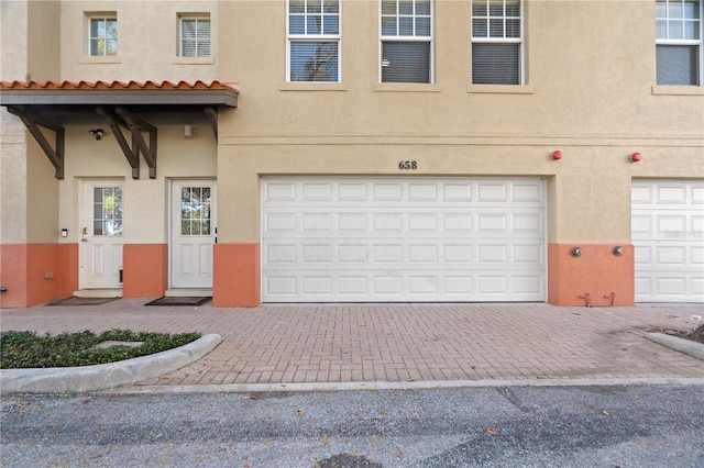 garage featuring driveway