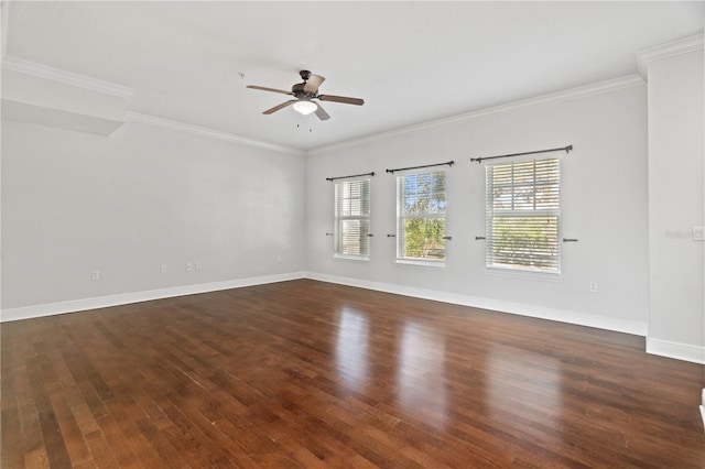 unfurnished room featuring baseboards, ornamental molding, a ceiling fan, and dark wood-style floors